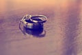 Wedding rings on table Royalty Free Stock Photo