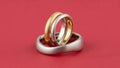 Two Wedding Rings on Red Background Royalty Free Stock Photo