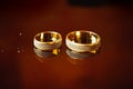 Two wedding rings on red background. Wedding rings