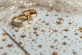 Two wedding rings resting on a table, perfect for wedding and love concepts Royalty Free Stock Photo