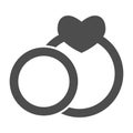 Two wedding rings solid icon. Couple engagement ring with heart shape symbol, glyph style pictogram on white background Royalty Free Stock Photo