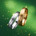 Two Wedding Rings on Sparkling Green Background Royalty Free Stock Photo