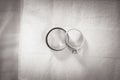 Two wedding rings on a textured background