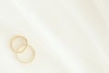 Two wedding rings under white bridal veil Royalty Free Stock Photo