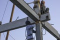 two weld worker man climb on concrete pile for welding steel make strong structure. no protect safety for work use skill and teamw Royalty Free Stock Photo