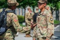 Two West Point Military Academy cadets in uniform talking