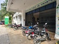 Two wheeler motor bike and scooty parked outside the government school and office building. Royalty Free Stock Photo