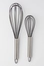 Two Whisks on White Background Top View Royalty Free Stock Photo