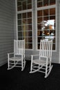 Two white Adirondack rocking chairs on front porch Royalty Free Stock Photo