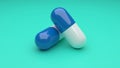 Two white-blue pills isolated on green background. Royalty Free Stock Photo