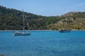 Two white boats sailing close to the coast blue aegean sea in Greece Royalty Free Stock Photo