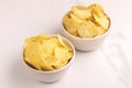 Two white bowls of tasty crispy potato chips Royalty Free Stock Photo