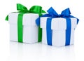 Two White boxs tied blue and green ribbons bow Isolated on white Royalty Free Stock Photo