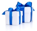 Two White boxs tied with blue satin ribbon bow Isolated on white Royalty Free Stock Photo