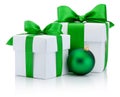 Two White boxs tied green satin ribbon bow and christmas ball Royalty Free Stock Photo