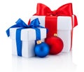 Two white boxs tied red and blue ribbon bow and christmas balls Royalty Free Stock Photo