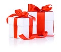 Two White boxs tied with a red satin ribbon bow Royalty Free Stock Photo