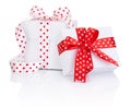Two White boxs tied satin ribbon with heart symbol bow