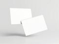 Two white business cards on gray background white cards blank cards floating cards Royalty Free Stock Photo