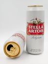 Two white cans of great Belgium beer - Stella Artois - on white background