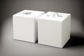 two white cardboard square tissue box on gray background Royalty Free Stock Photo