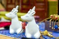 Two white ceramic unicorn wildebeest toys Royalty Free Stock Photo