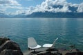 Two white chairs at Geneve lake