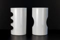 Two white china cups on a black background. Royalty Free Stock Photo