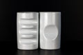 Two white china cups on a black background. Royalty Free Stock Photo