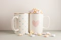 Two white cups with lovely heart prints