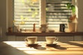 Two white cups on a table with a view of the window Royalty Free Stock Photo
