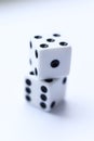 Two white dice with black dots on a white background. Royalty Free Stock Photo