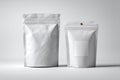 Two white doypack packaging with zipper and blank label standing on white background Royalty Free Stock Photo