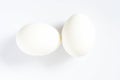 Two white eggs on a white background with shadow Royalty Free Stock Photo