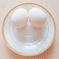 Two white eggs on a plate Royalty Free Stock Photo