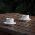 Two white empty espresso coffee cups on table Royalty Free Stock Photo