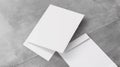 Two white envelopes on a concrete floor with one folded, AI Royalty Free Stock Photo