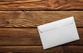 Two white envelopes with letters on old wooden dark background. Blanks for the designer. Concepts, ideas for postal services and e Royalty Free Stock Photo