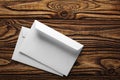 Two white envelopes with letters on old wooden dark background. Blanks for the designer. Concepts, ideas for postal services and e Royalty Free Stock Photo