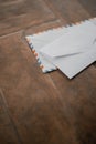 Two white envelopes on a wooden table Royalty Free Stock Photo