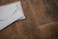 Two white envelopes on a wooden table Royalty Free Stock Photo