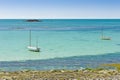 fishing boats turquoise sea Jersey Channel Islands Royalty Free Stock Photo