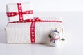 Two white gift boxes with polka dots a red ribbon. Royalty Free Stock Photo