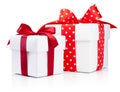 Two white gift boxes tied red ribbon bow  on white background Royalty Free Stock Photo