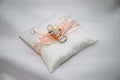 Two white gold wedding rings on white lace pad Royalty Free Stock Photo