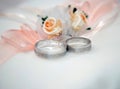 Two white gold wedding rings on white lace pad Royalty Free Stock Photo