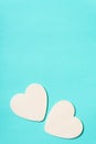 Two white hearts on green pastel background Royalty Free Stock Photo