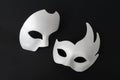 Two white masquerade masks on a black background Royalty Free Stock Photo