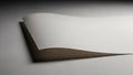 Two white sheets of paper gently curving and overlapping with soft studio lighting casting subtle shadows on a neutral gray Royalty Free Stock Photo