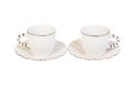 Two white porcelain tea, coffee cups with saucer. Isolated on white Royalty Free Stock Photo